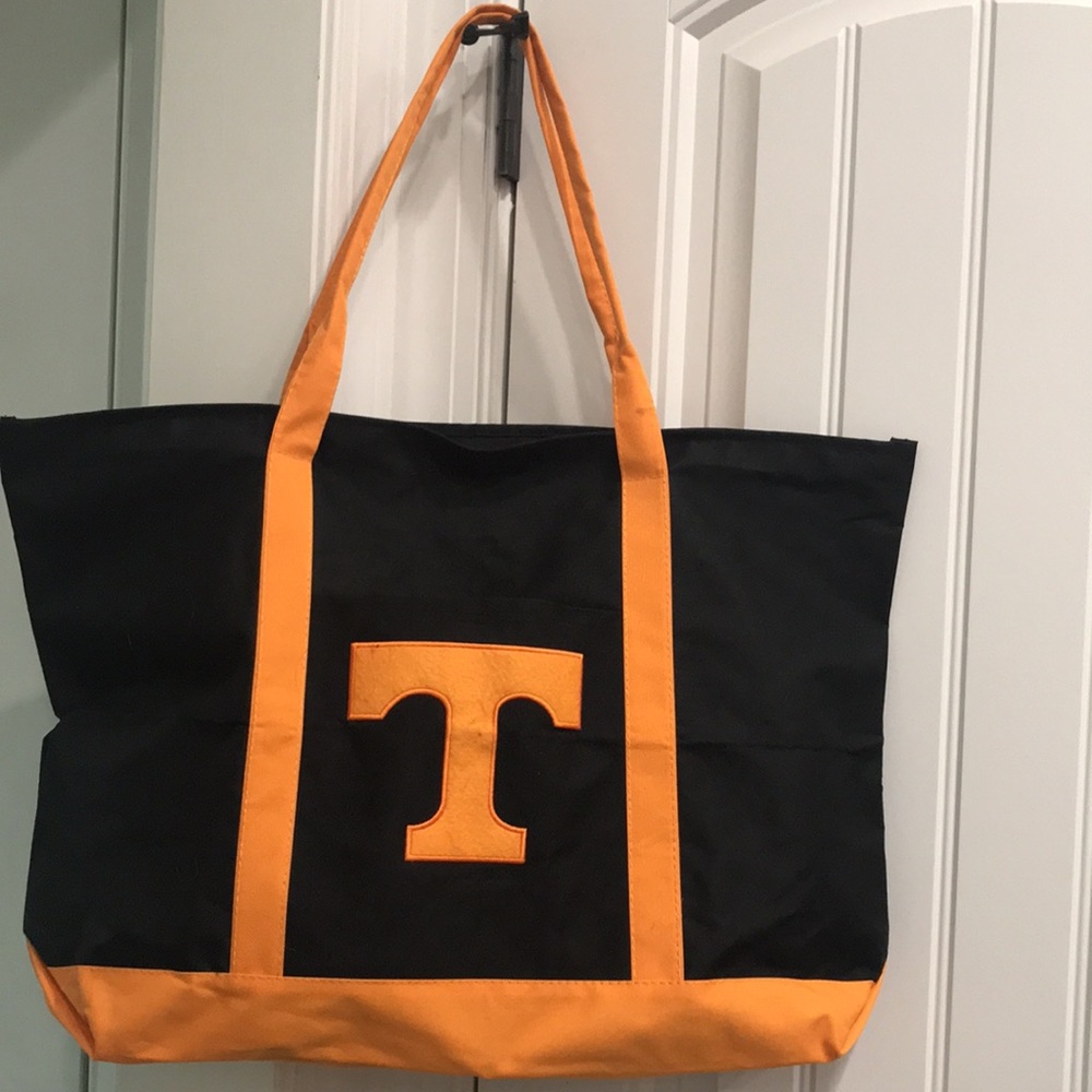 TOTE black/orange “ T “  Tennessee VOLS carry all. CANVAS material.VERY STRONG